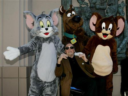 Joseph Barbera poses with three of the characters Scooby-Doo (C) along with Tom and Jerry (R)
